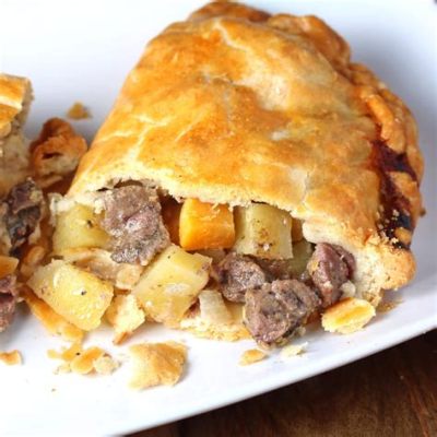  Cornish Pastija: A Savory Delight Bursting with Tender Meat and Aromatic Vegetables Wrapped in a Flaky Pastry Crust!